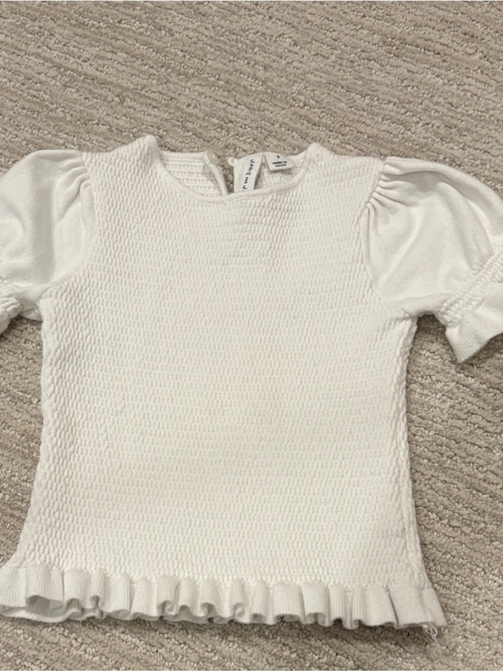 White Textured Knit Top with Ruffle Hem